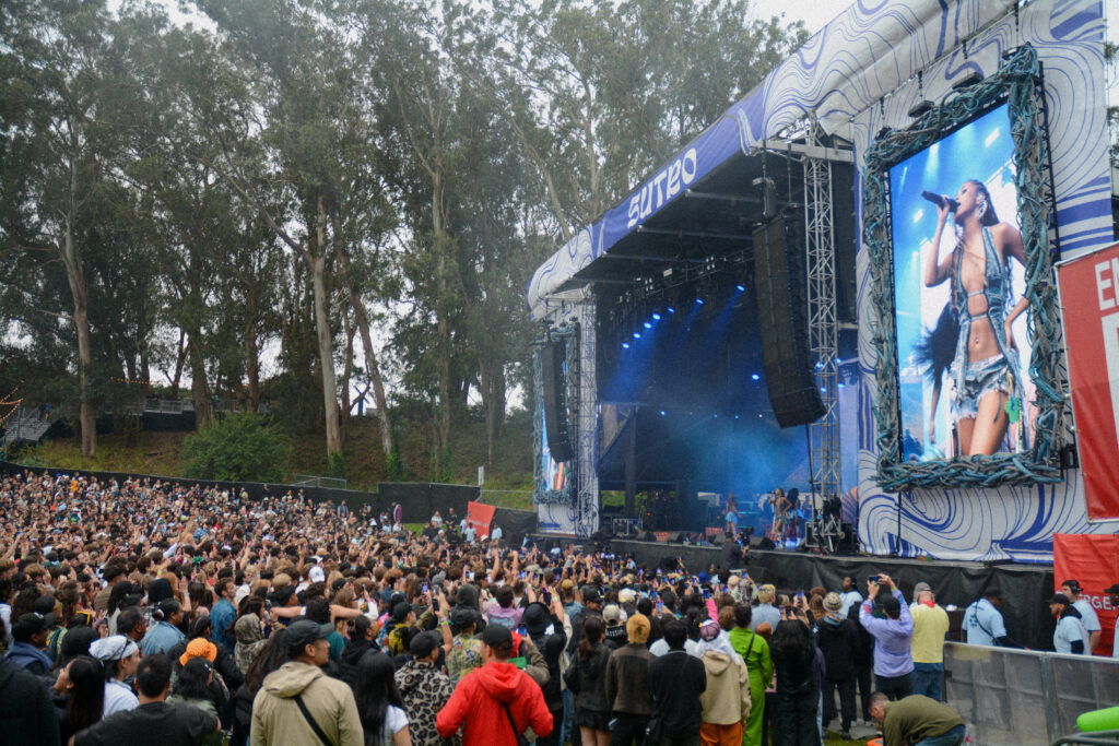 Tyla performing on stage in front of a crowd in Golden Gate Park