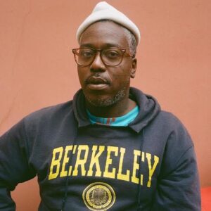 Head shot of of Brontez Purnell with a UC Berkeley sweatshirt on.