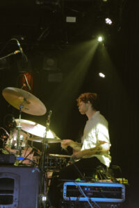 A drummer performing on stage