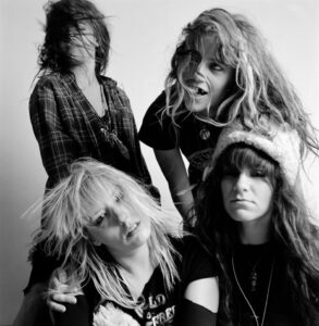 B&W picture of 4 members of L7.