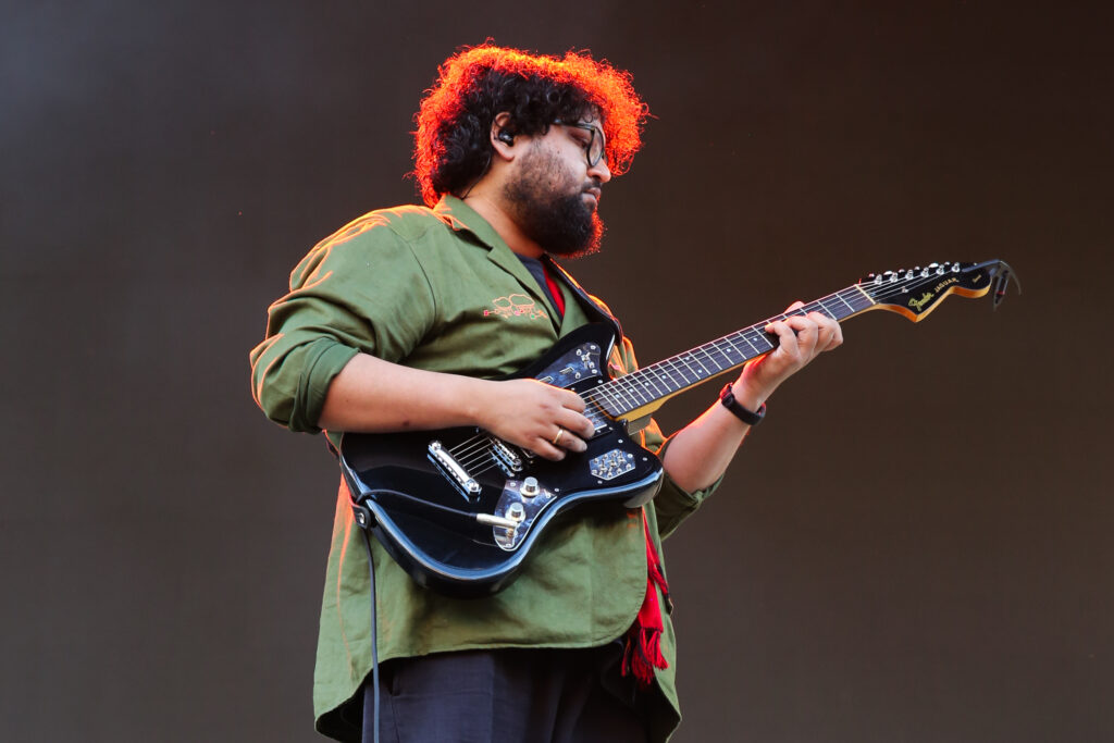 Man playing electric guitar on stage