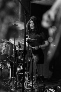 Audrey Paris Johnson of La Luz playing drums on stage