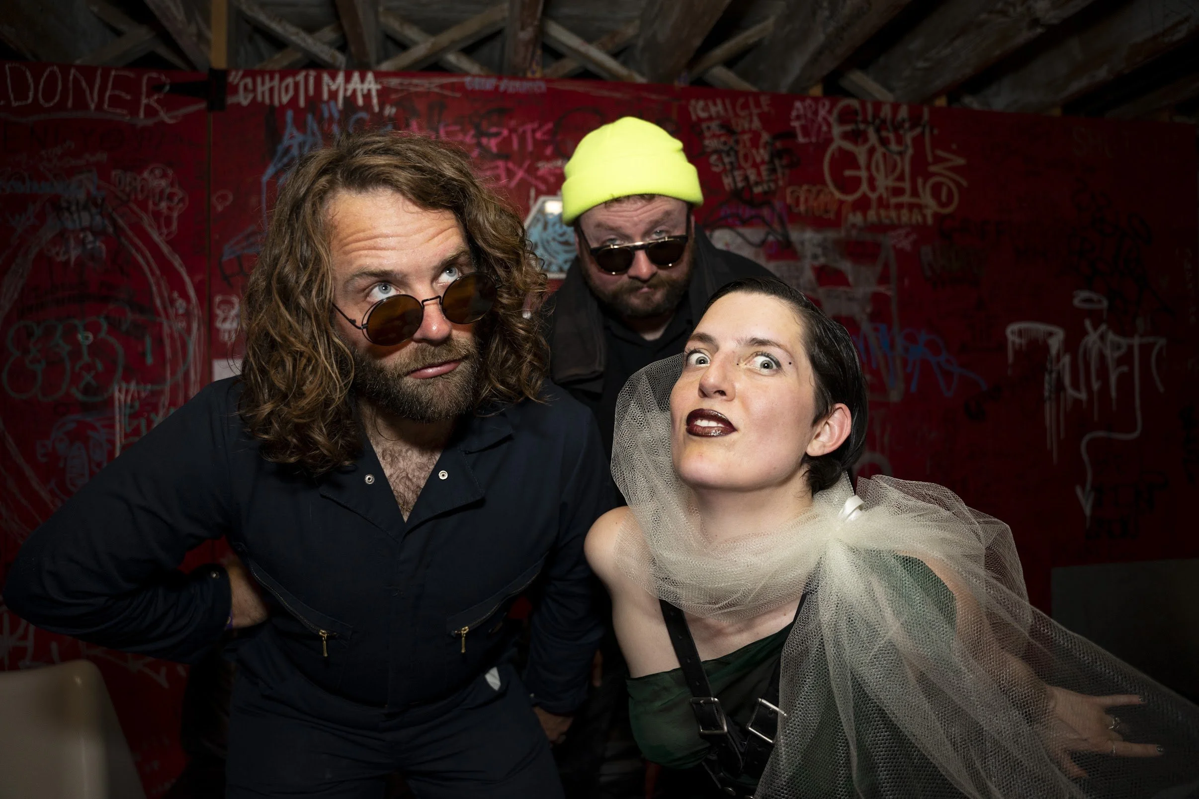 All three members of Pleeay staring intently at the camera